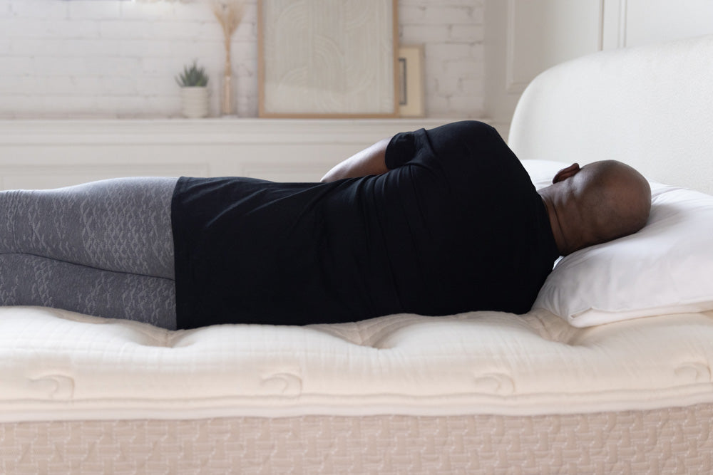 african american man laying on lytton mattress